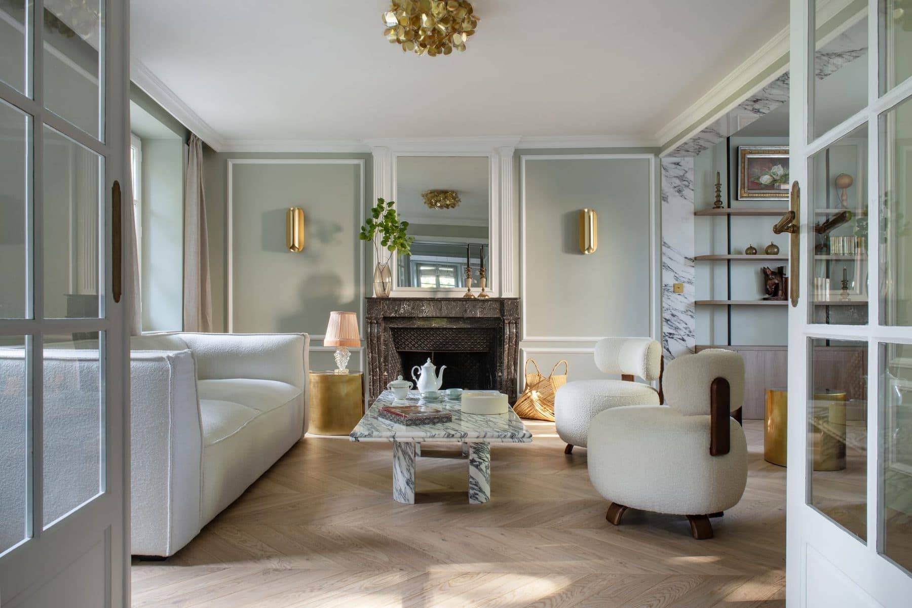 Living room with marble fireplace and glass partition